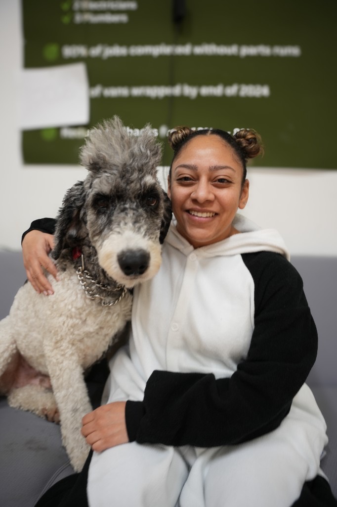 An Eco team member relaxing with the office dog