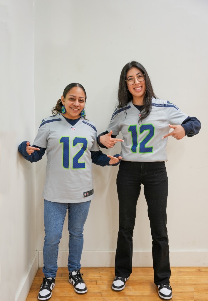 Eco team members repping Seattle Seahawks gear on game day